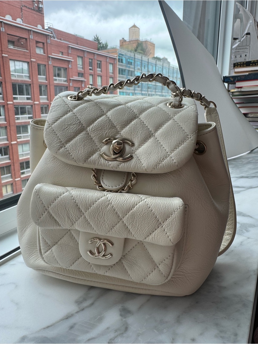 CHANEL Cream Quilted Leather Drawstring Backpack with Chain Handle